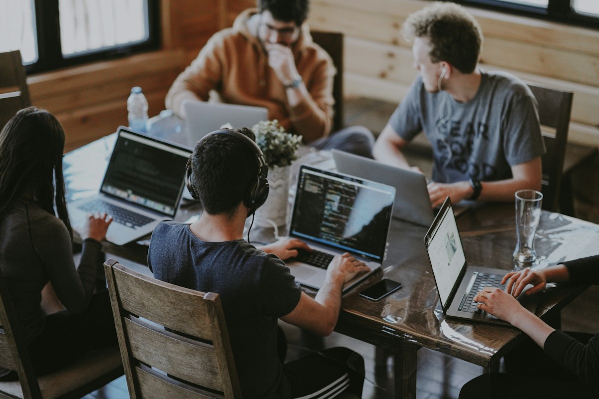 Colleagues working together in a technology team